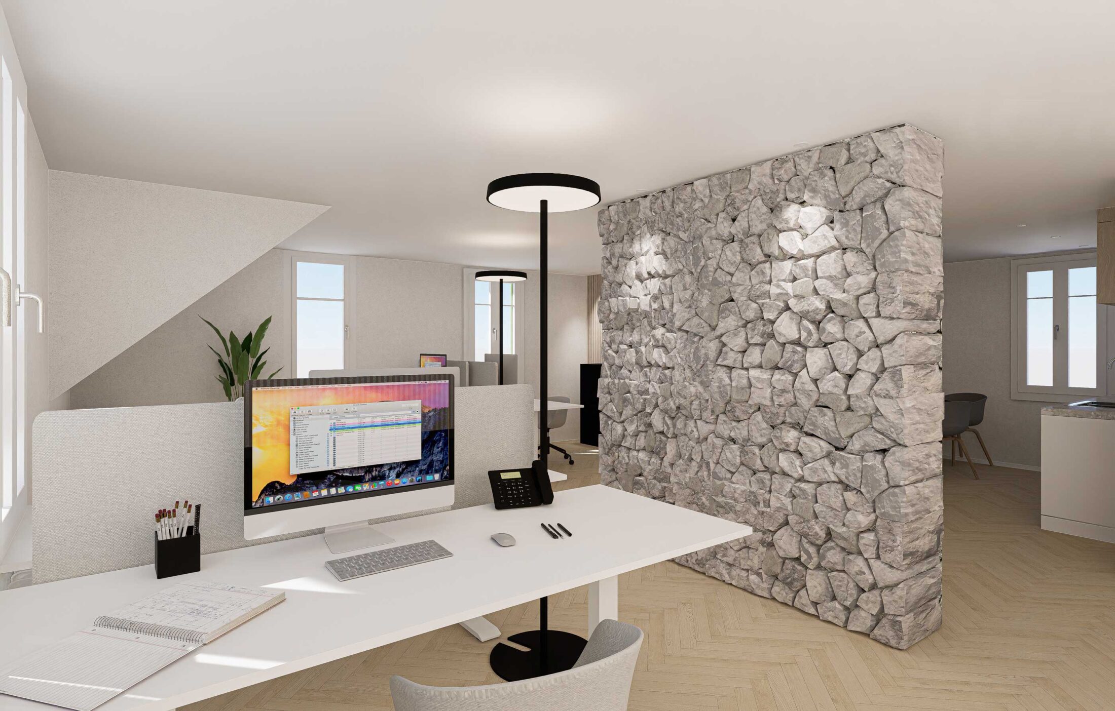 Büroraum eines Bürogebäudes mit Fokus auf Steinwand in Kehrsiten, Nidwalden